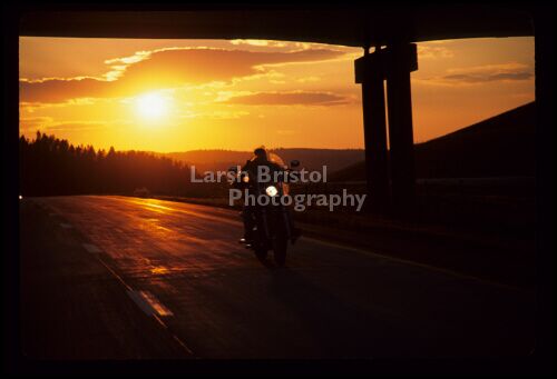 Motorcycle on road at Sunset 