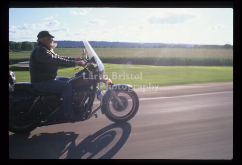 Motorcycle Passing Field 