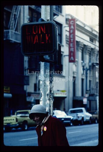 Woman at Pedestrian Crossing Sign