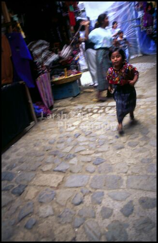 Child Plays at the Market