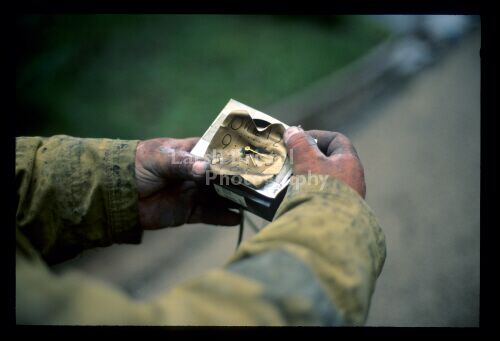 Fireman Holding Burned Clock