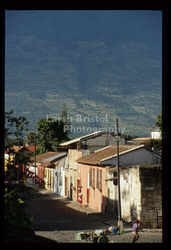 Row of buildings at bottom of mountain