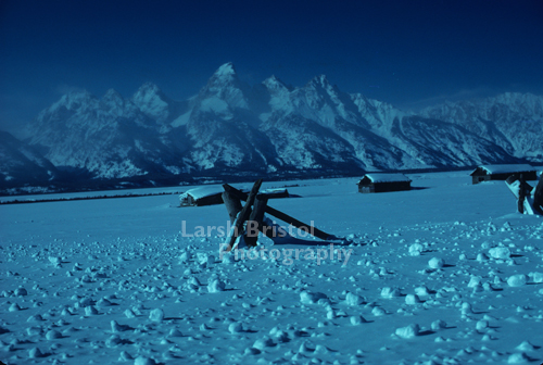 Snow Covered Field and Mountains