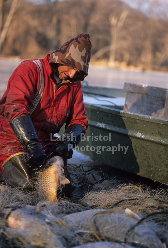 Man kneeling with fish